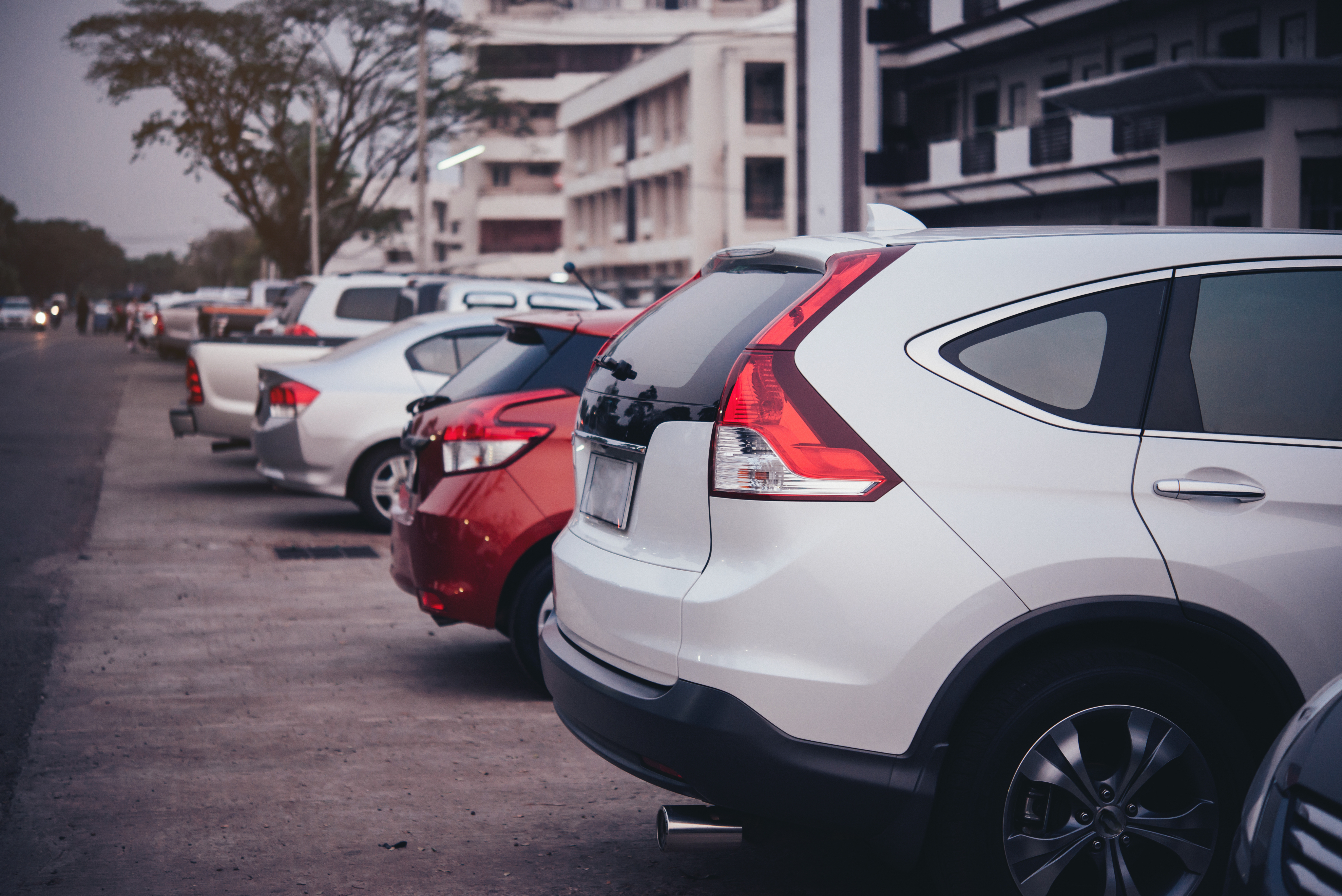 Row of cars parked in a lot